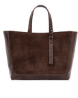 Brown semi suede-textured handbag on a white background