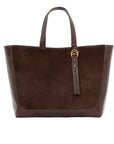 Brown semi suede-textured handbag on a white background