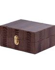 Dark brown ostrich textured watch box with a gold clasp on a white background