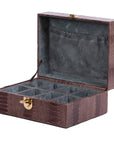 Dark brown ostrich textured watch box with a gold clasp on a white background