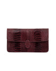 Burgundy textured clutch bag on a white background