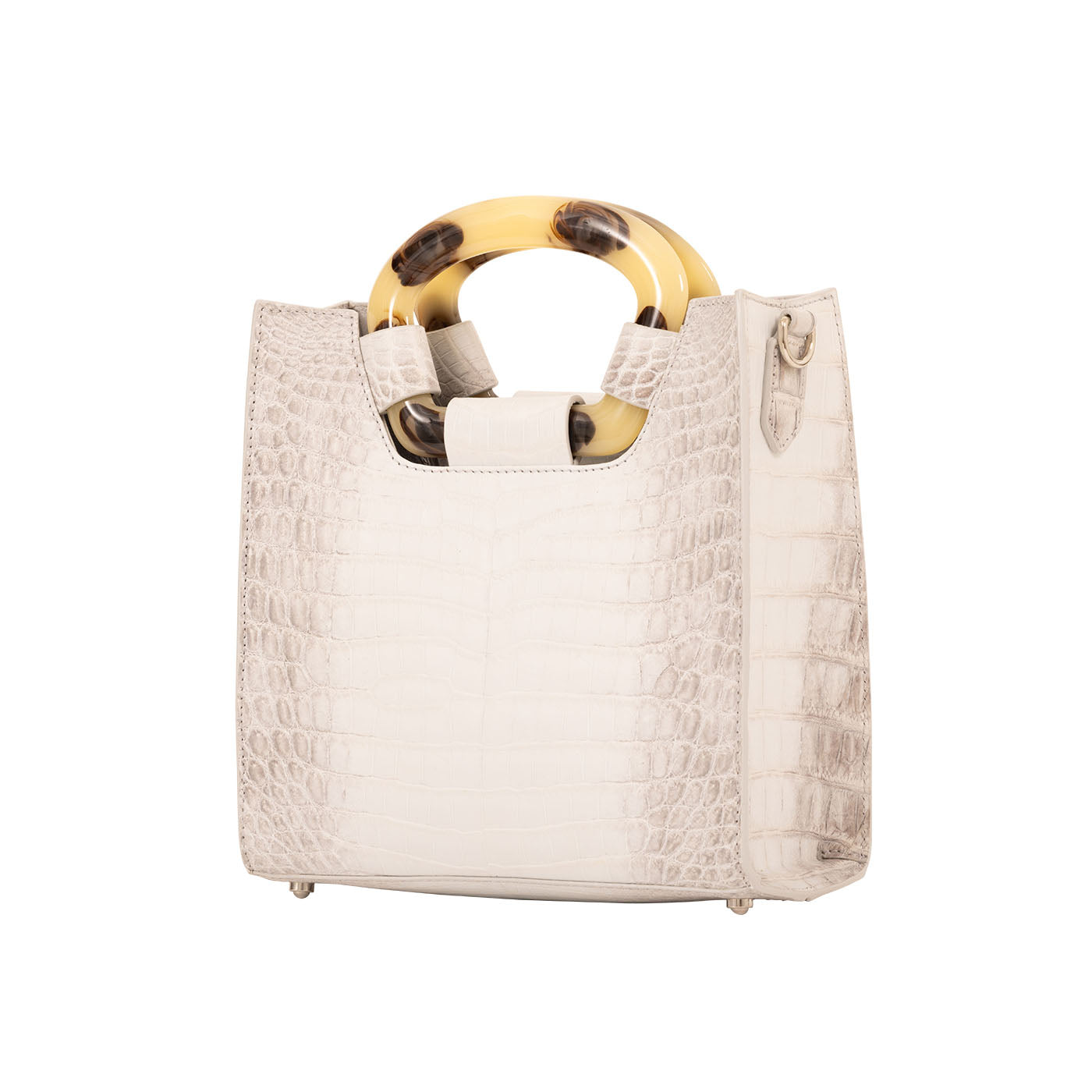 Side of a white textured handbag on a white background