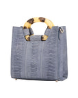 Blue textured handbag on a white background