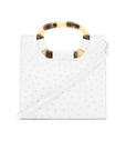 Fron of a white ostrich textured handbag with a strap on a white background
