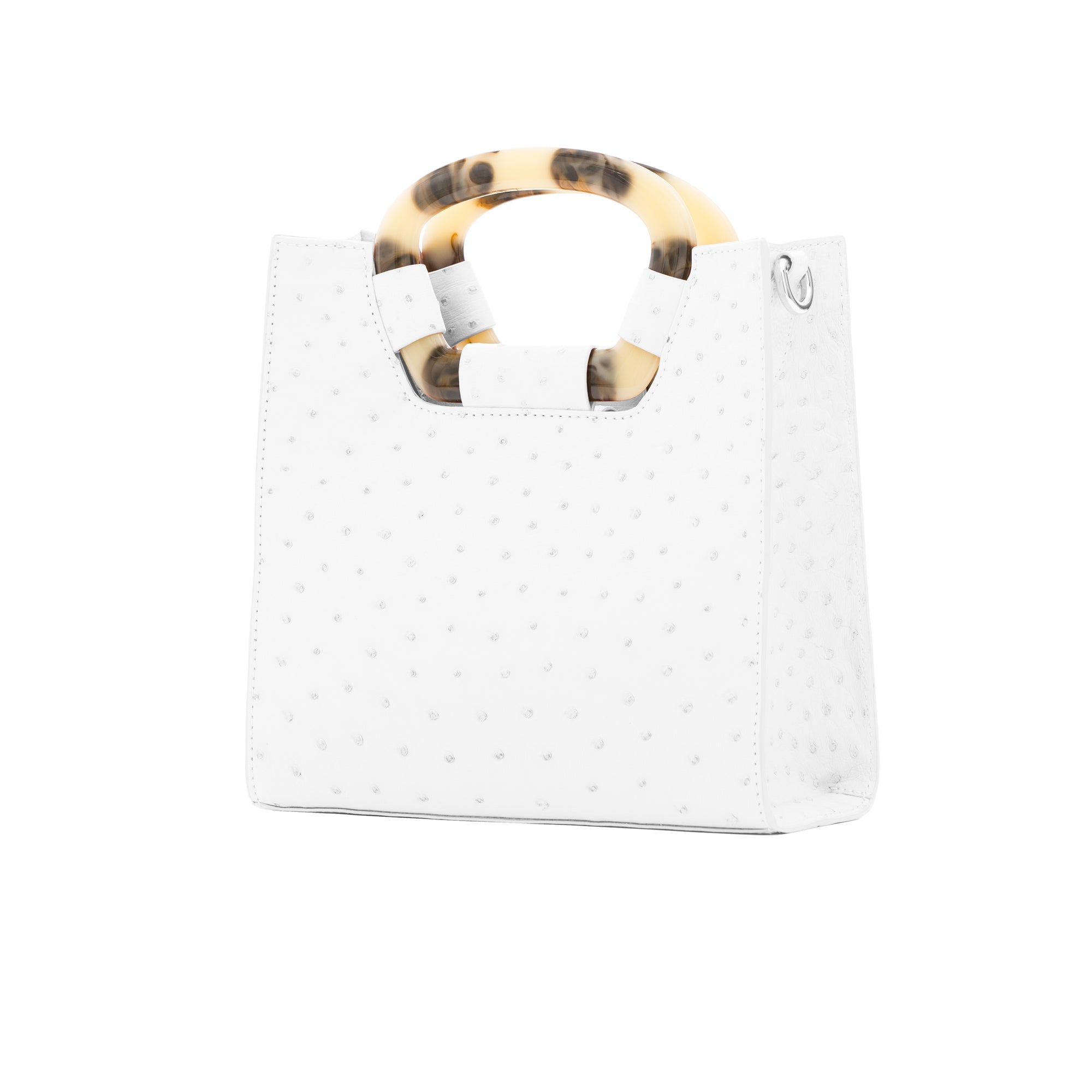 Side of a white ostrich textured handbag on a white background