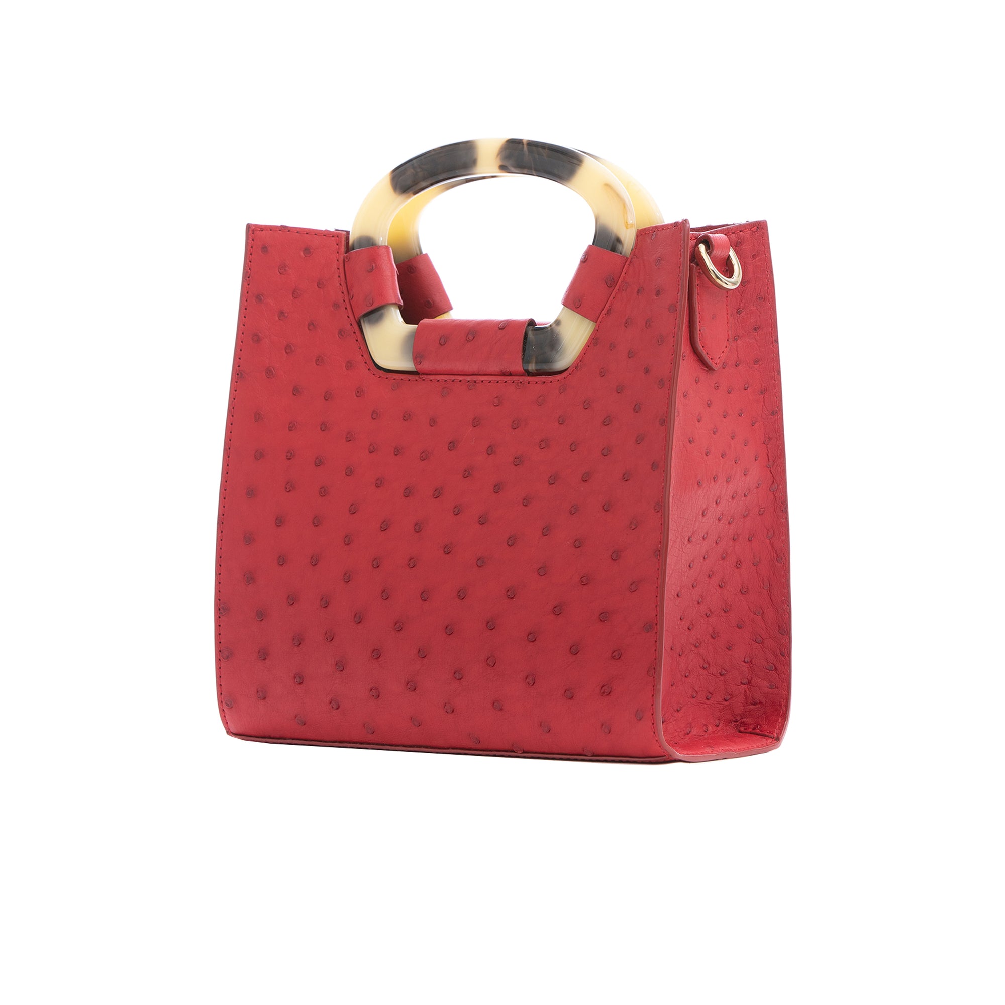 Side of a red ostrich textured handbag on a white background