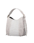 White crocodile-patterned handbag on a white background