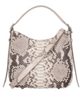 Snakeskin pattern handbag with a a strap on a white background
