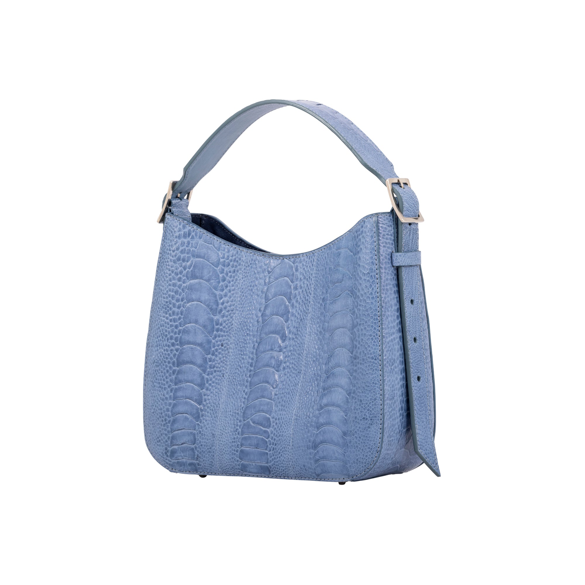 Side of a blue textured handbag on a white background