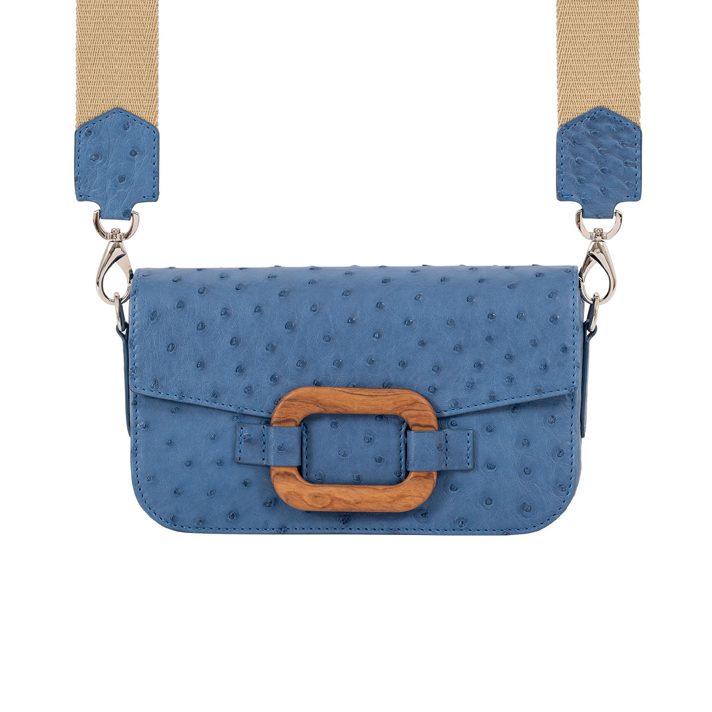 Front of a blue ostrich textured handbag with straps on a white background