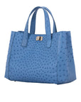 Blue ostrich-textured tote bag on a white background