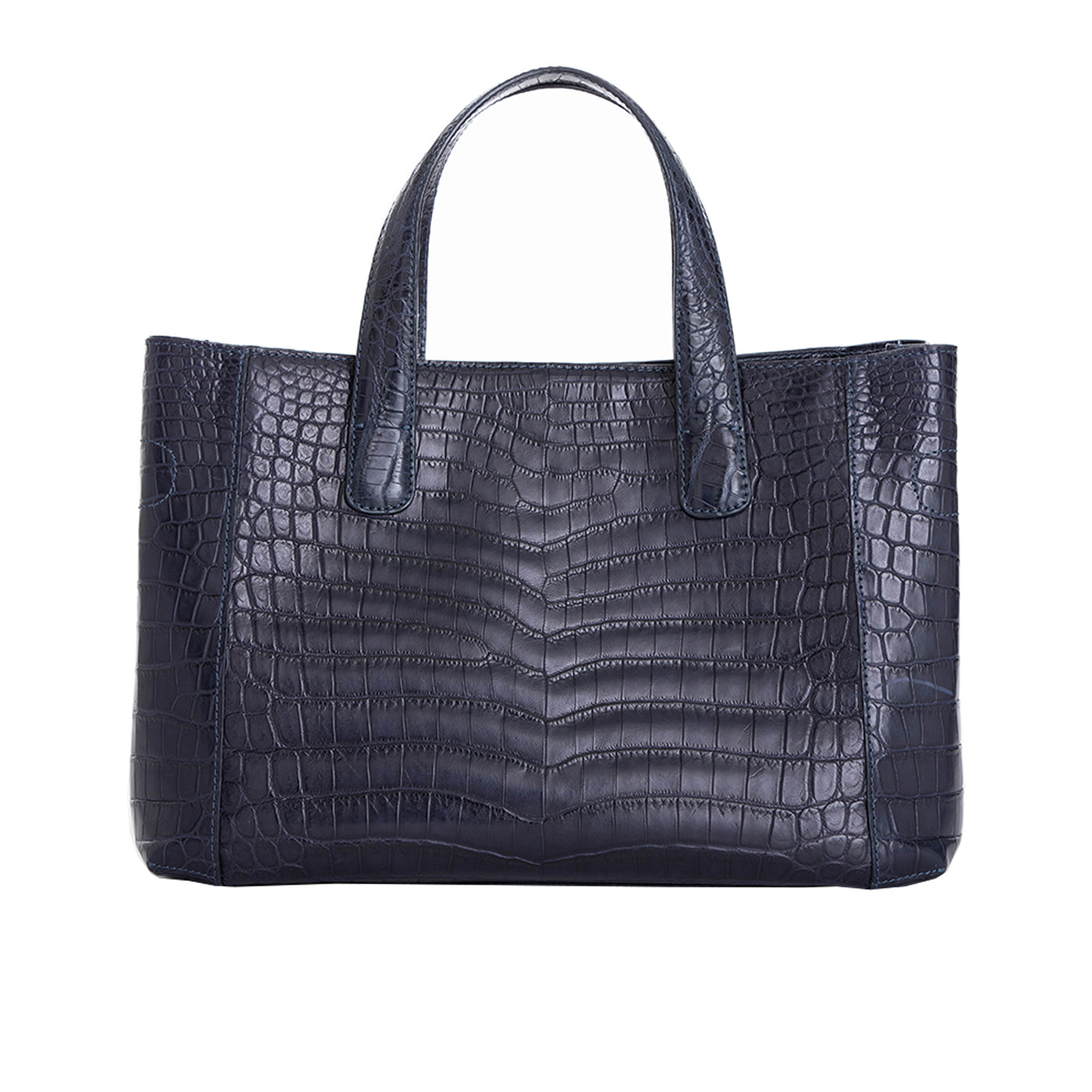Back of a navy crocodile textured handbag on a white background