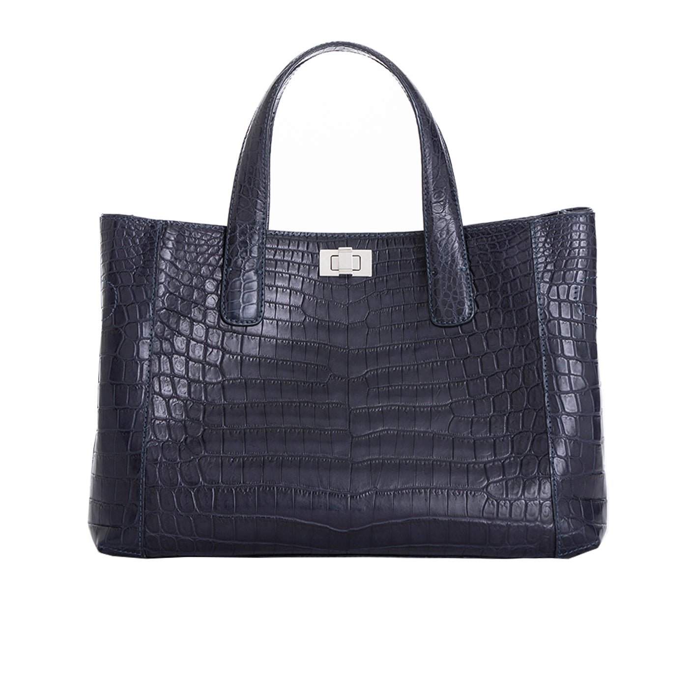 Front of a navy crocodile textured handbag on a white background