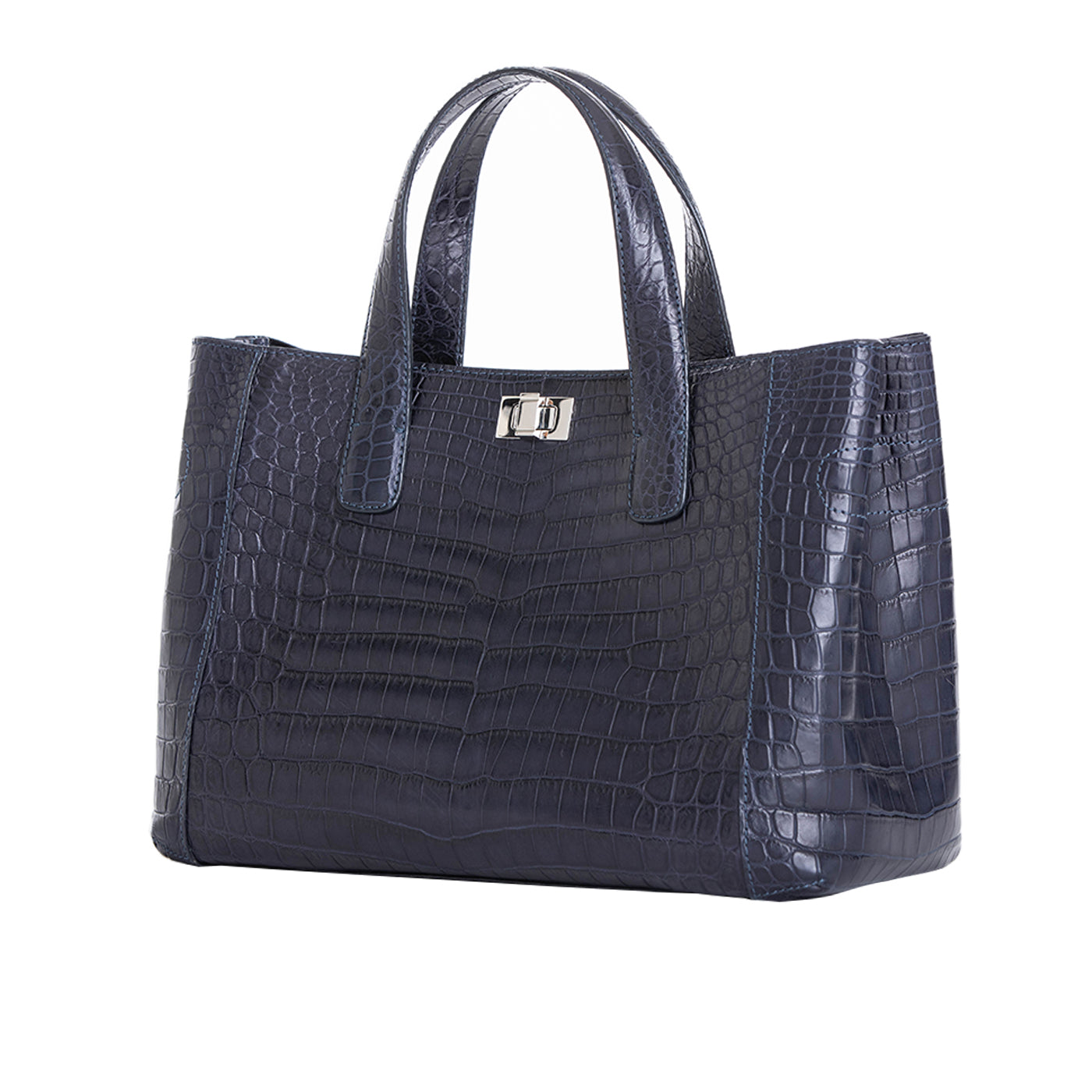 Side of a navy crocodile textured handbag on a white background
