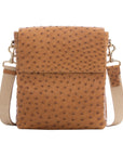 Brown ostrich textured messenger bag on a white background