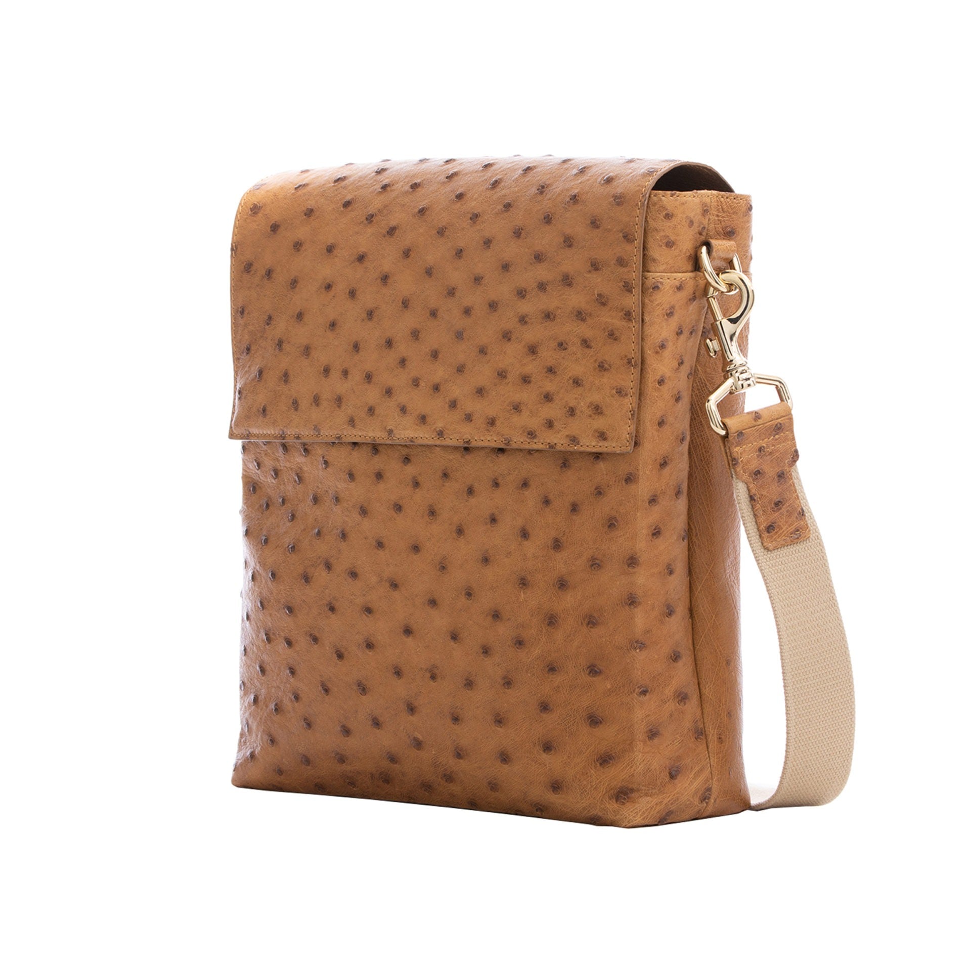Brown ostrich textured messenger bag on a white background
