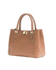 Brown handbag with gold accents on a white background