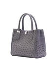 Gray textured handbag on a white background