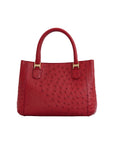 Red handbag with gold accents on a white background