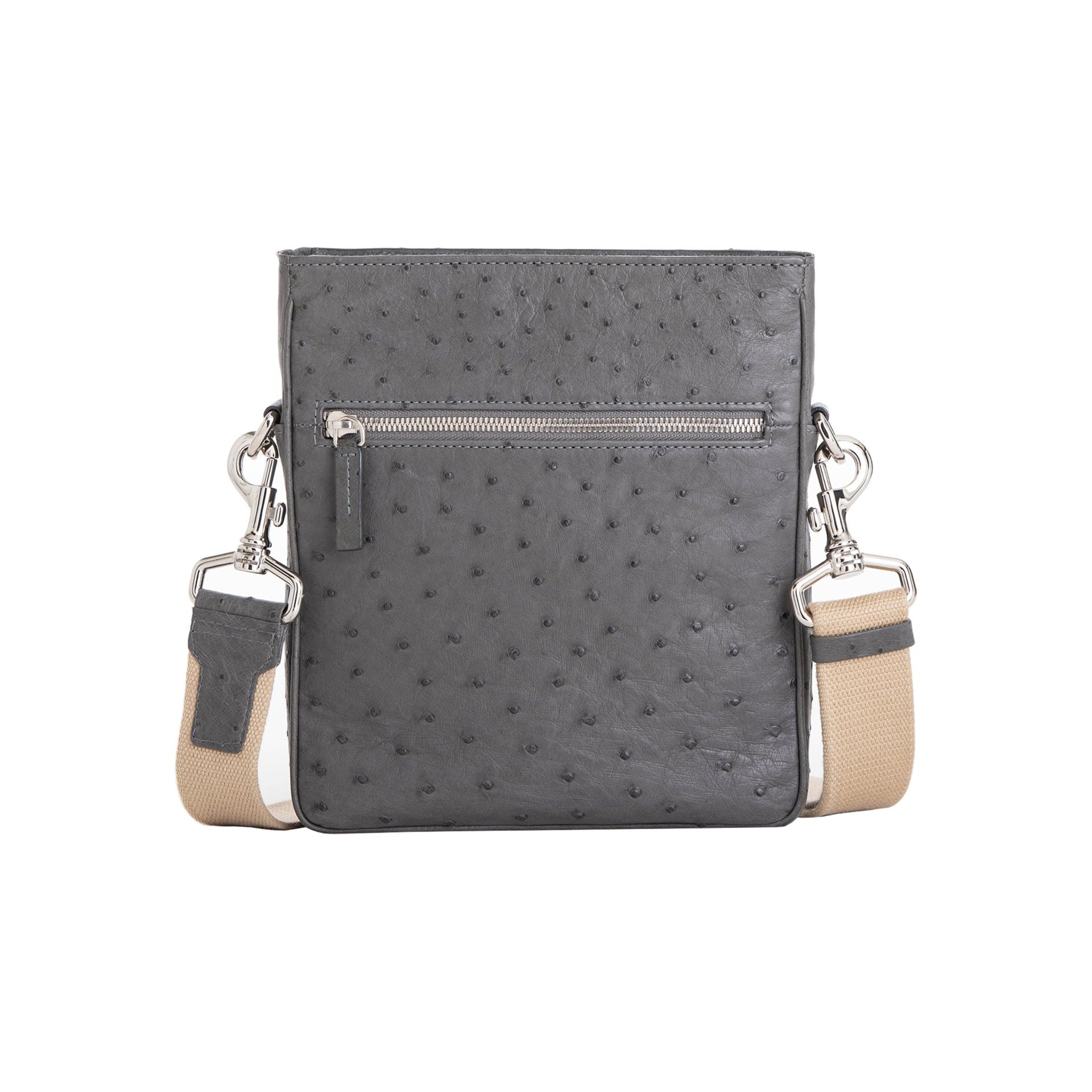 Anthracite ostrich leather crossbody bag with zipper and strap on a white background