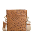 Antique brown ostrich leather crossbody bag with zipper and strap on a white background