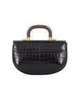 Back of a black crocodile-patterned handbag with wooden handle on a white background
