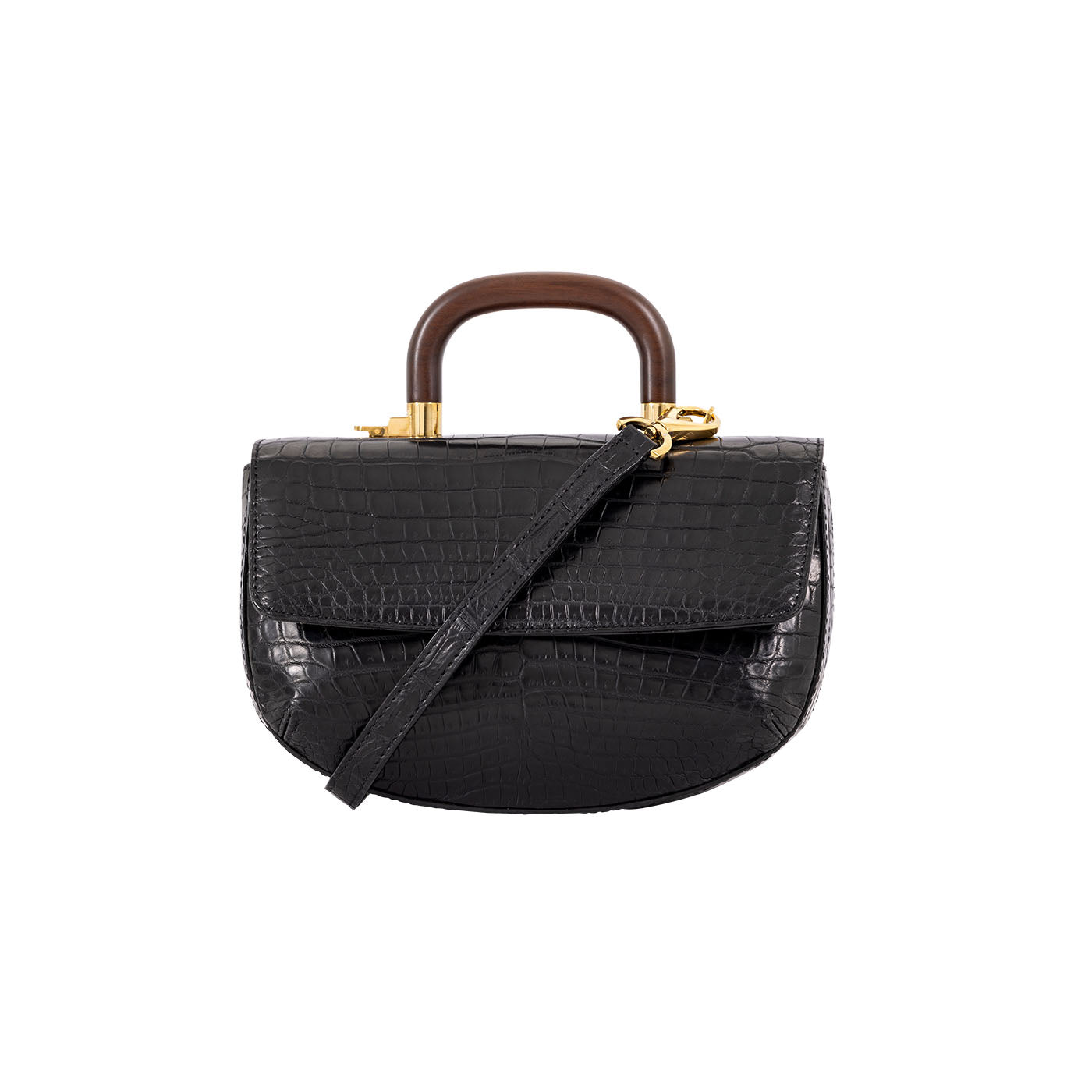 Front of a black crocodile-patterned handbag with a strap and  wooden handle on a white background