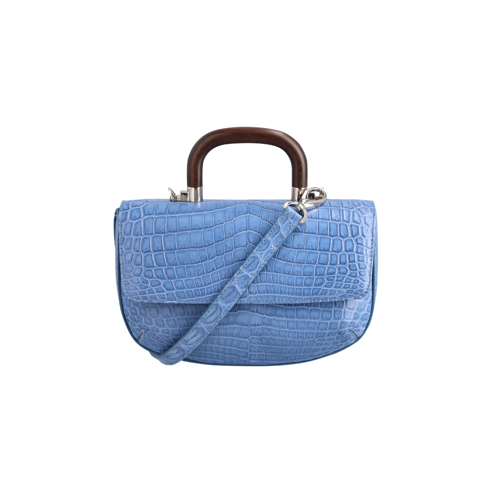 Front of a blue crocodile handbag with a strap and wooden handle on a white background