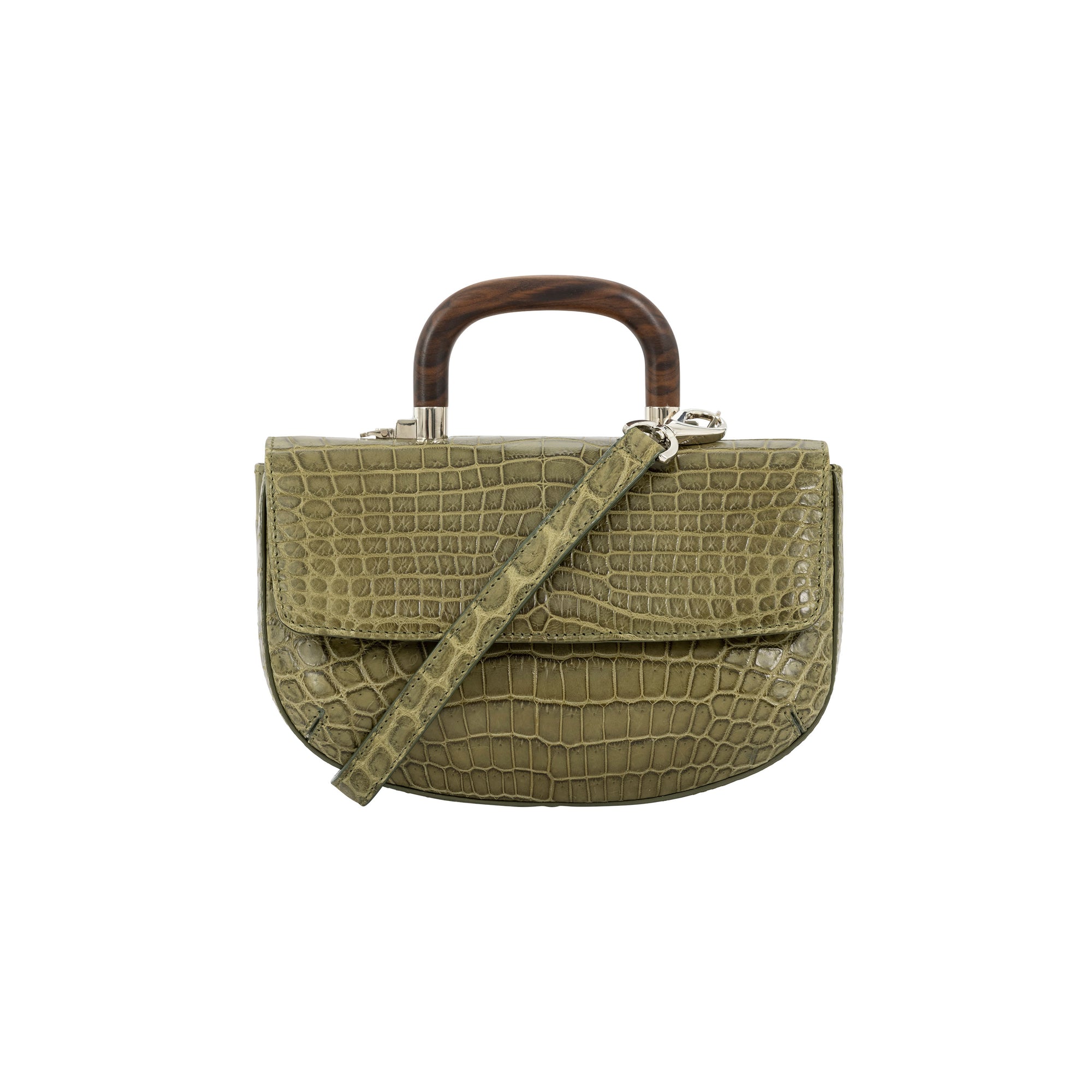 Front of a forest green crocodile handbag with a strap and wooden handle on a white background
