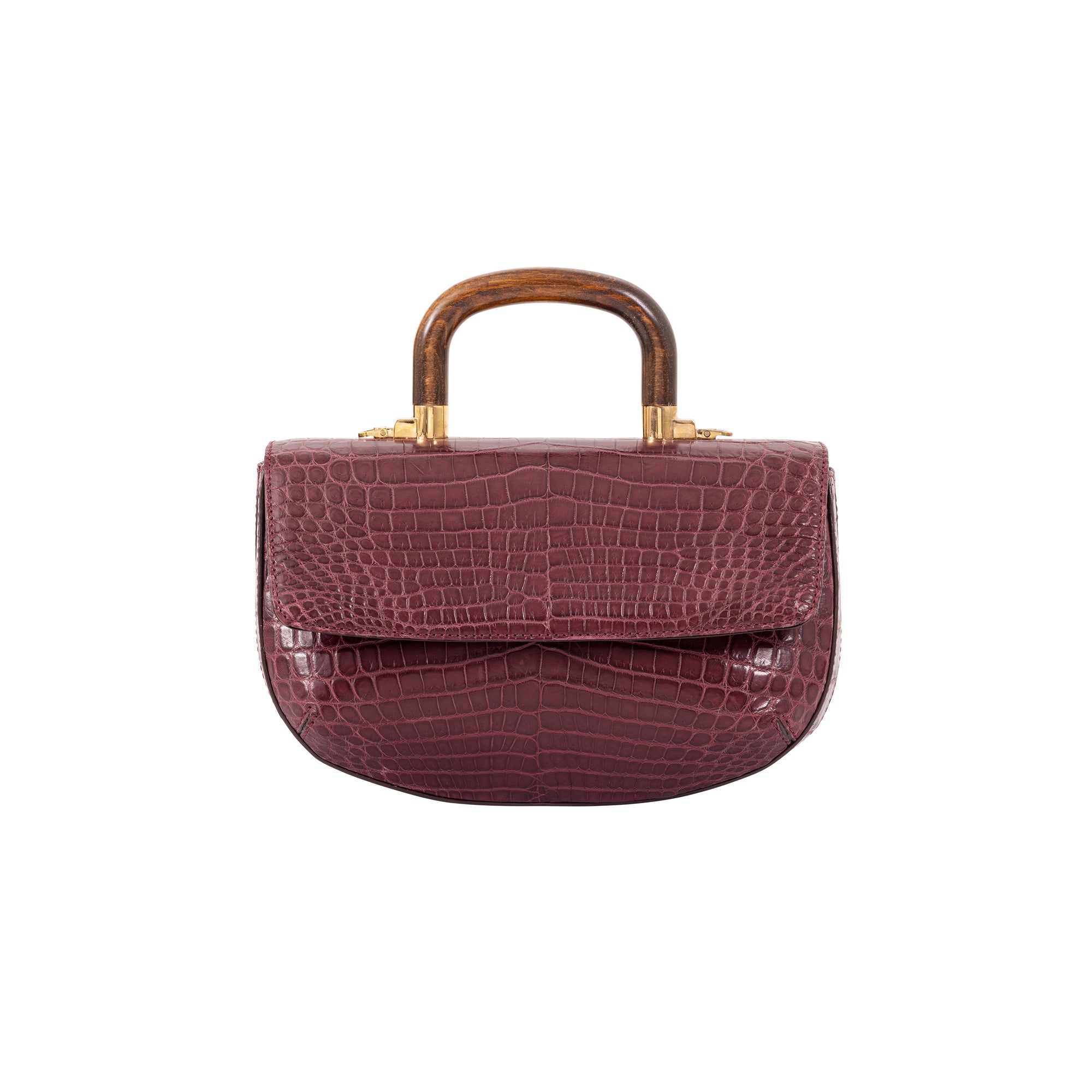 Front of a maroon crocodile handbag with wooden handle on a white background