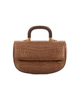 Front of brown crocodile-patterned handbag on a white background
