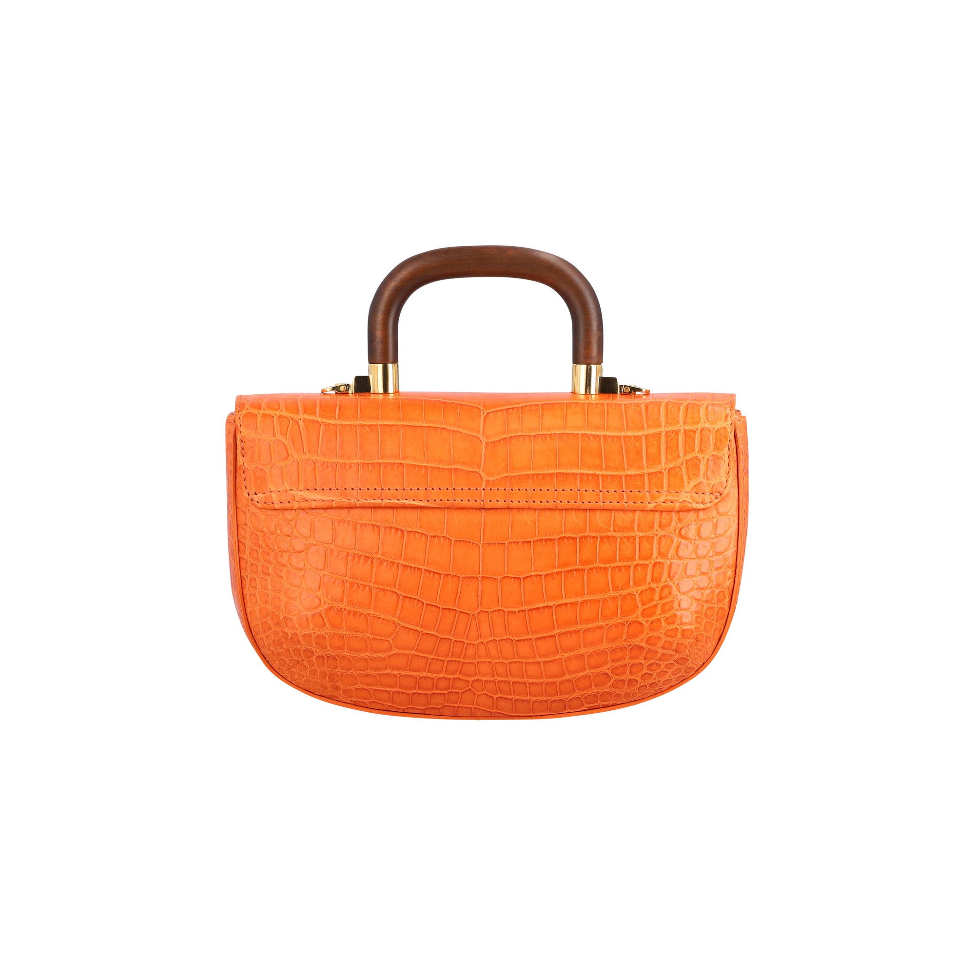 Back of a tangerine crocodile textured handbag with wooden handle on a white background
