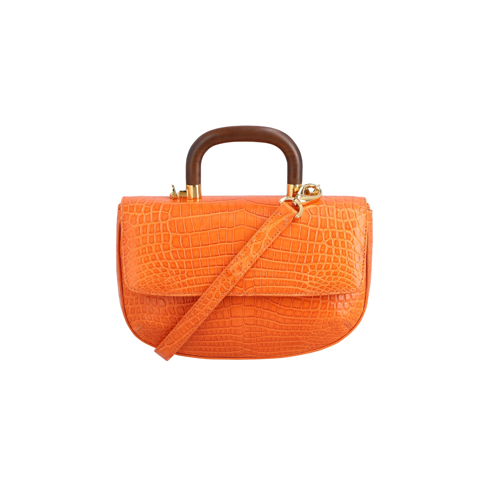 Front of a tangerine crocodile textured handbag with a strap and wooden handle on a white background