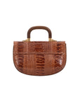 Back of cognac handbag with a wooden handle on a white background