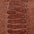 Close-up of cognac leather texture with embossed pattern