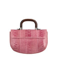 Back of a pink textured handbag with wooden handle on a white background