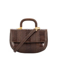 Front of a brown textured handbag with gold accents and a wooden handle on a white background