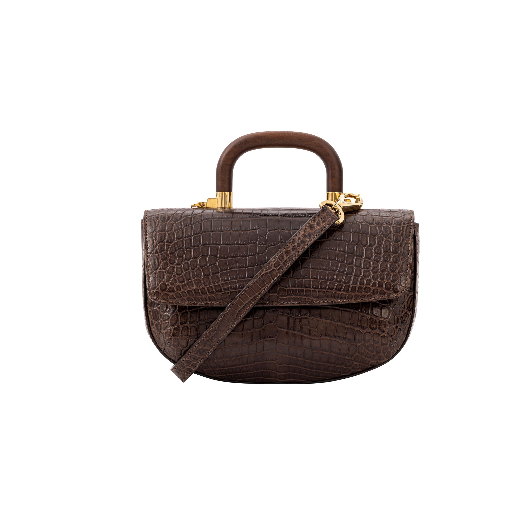 Front of a brown crocodile handbag with a strap and wooden handle on a white background