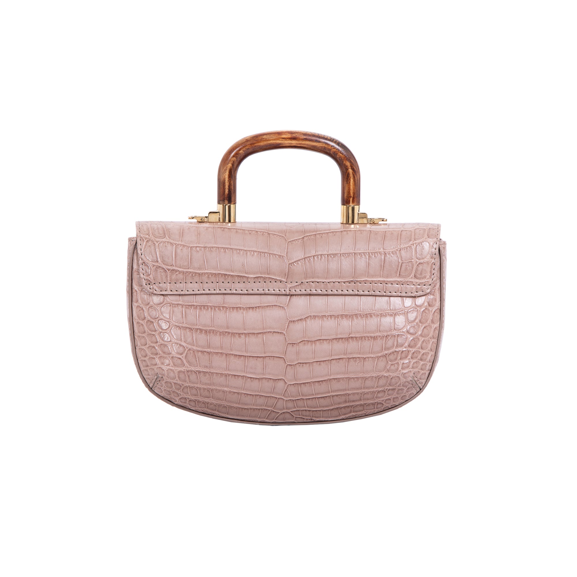 Back of a walnut crocodile handbag with a wooden handle on a white background