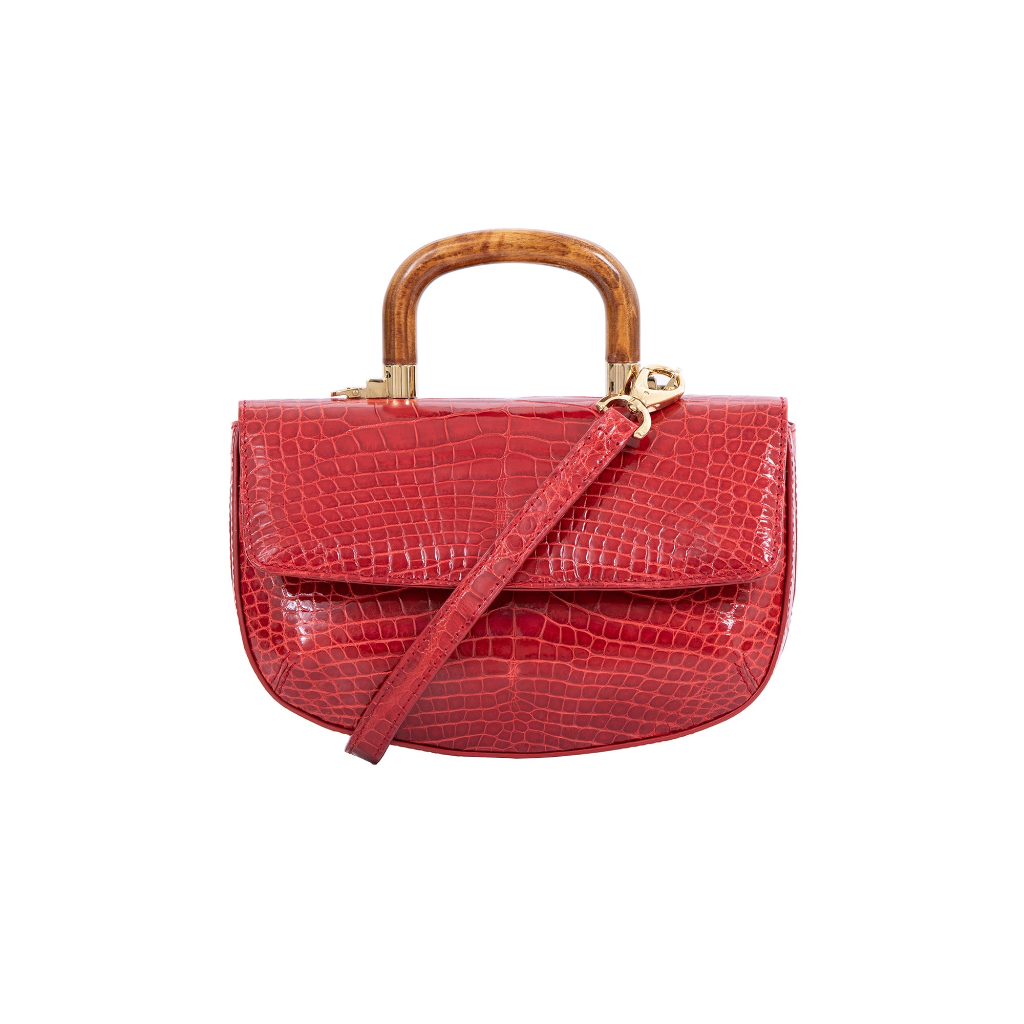 Red crocodile handbag with a wooden handle on a white background