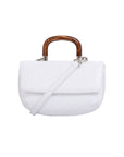 Front of a white ostrich handbag with a strap and wooden handle on a white background