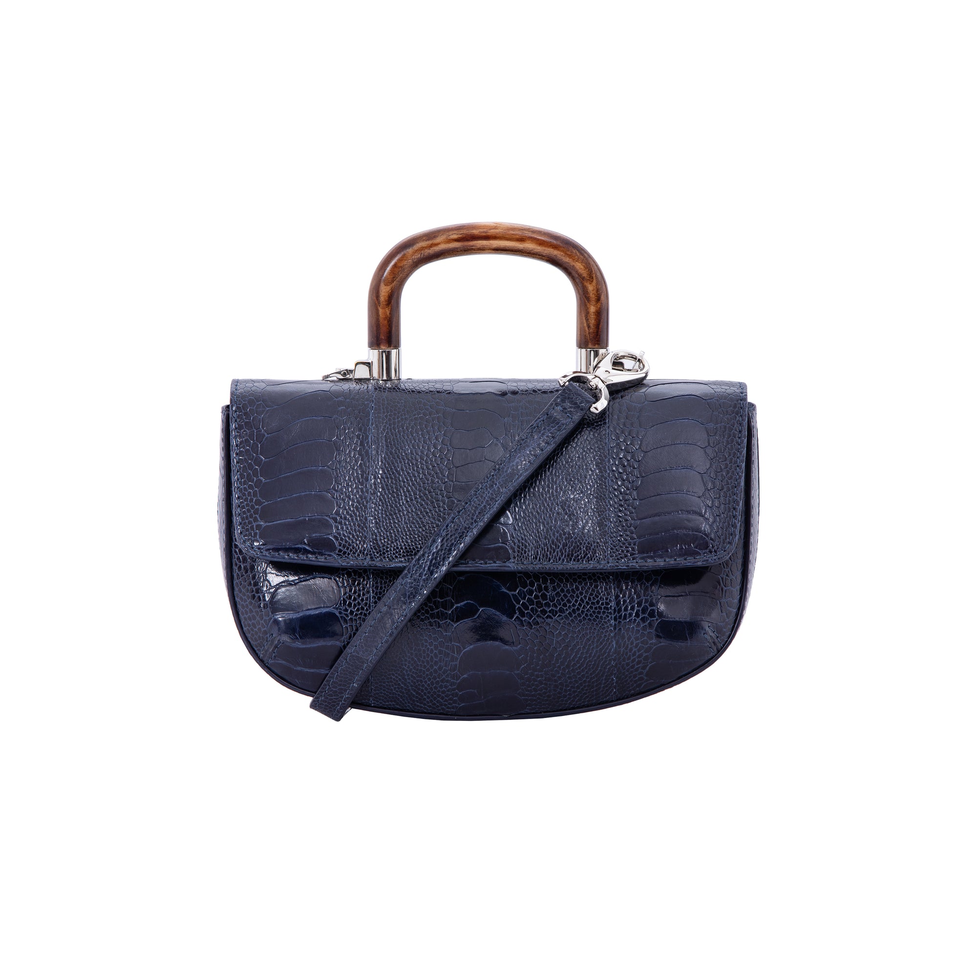 Front of a navy ostrich leg handbag with a strap and a wooden handle on a white background