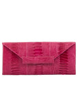 Front of a pink ostrich leg textured handbag on a white background