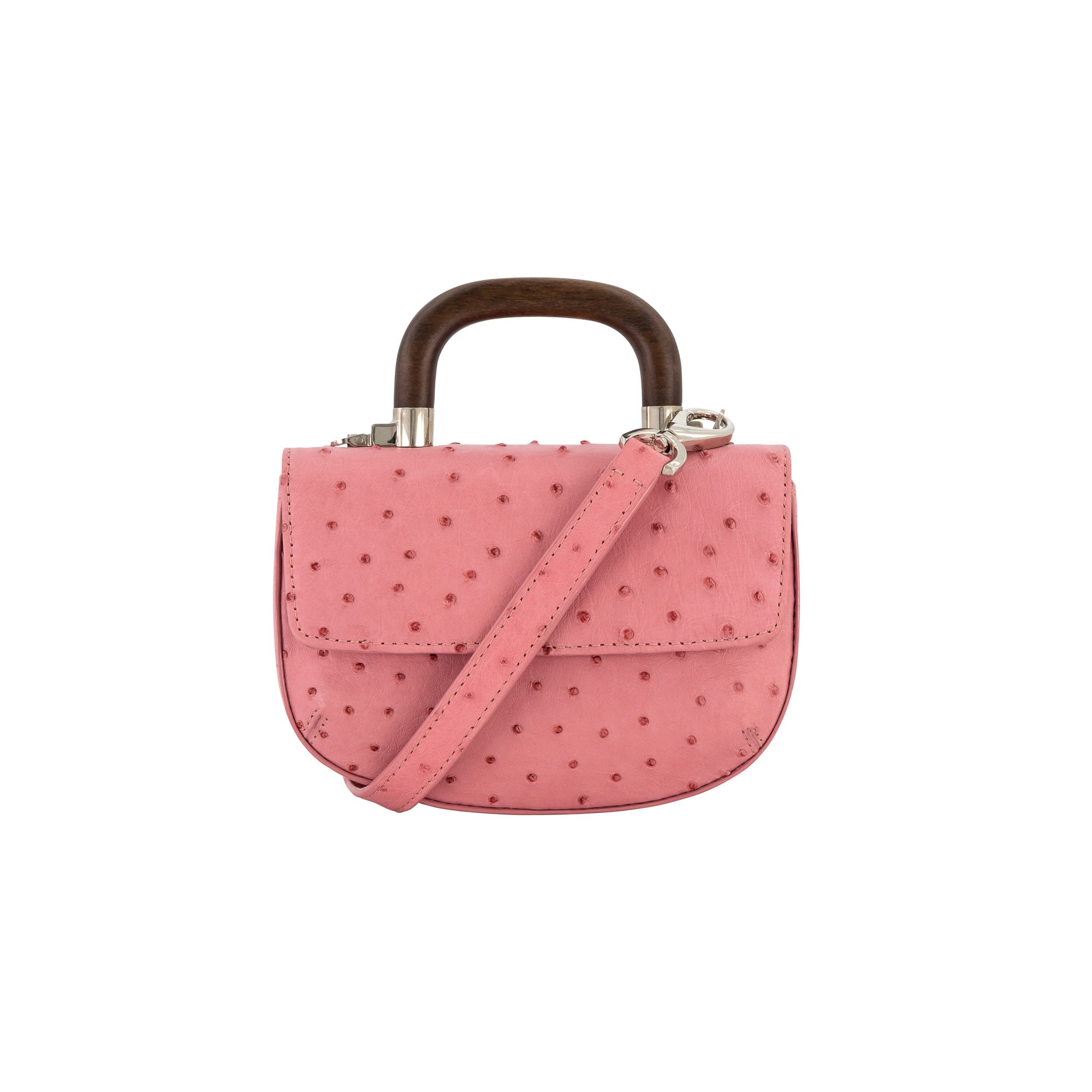 Front of a pink ostrich textured handbag with a strap and wooden handle on a white background