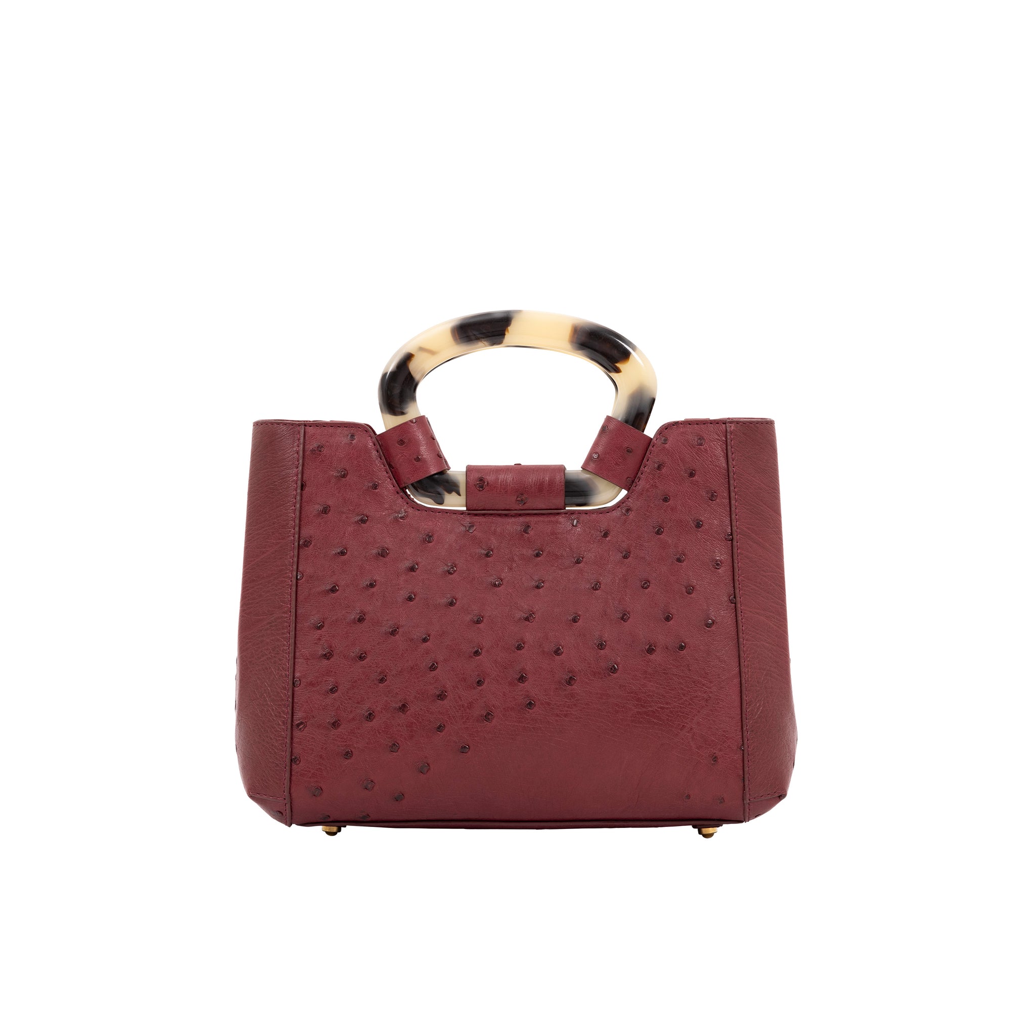 Back of maroon ostrich handbag with a handle on a white background