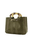 Side of a forest green textured handbag on a white background