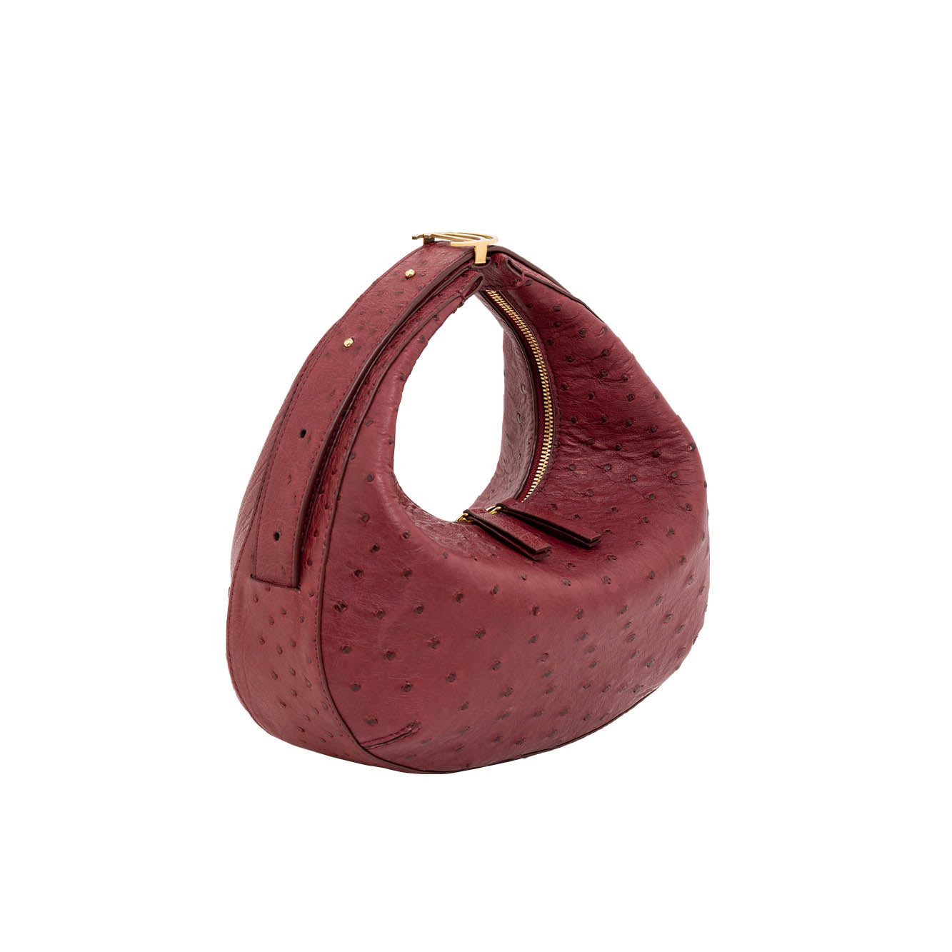Red ostrich-textured handbag with gold accents on a white background