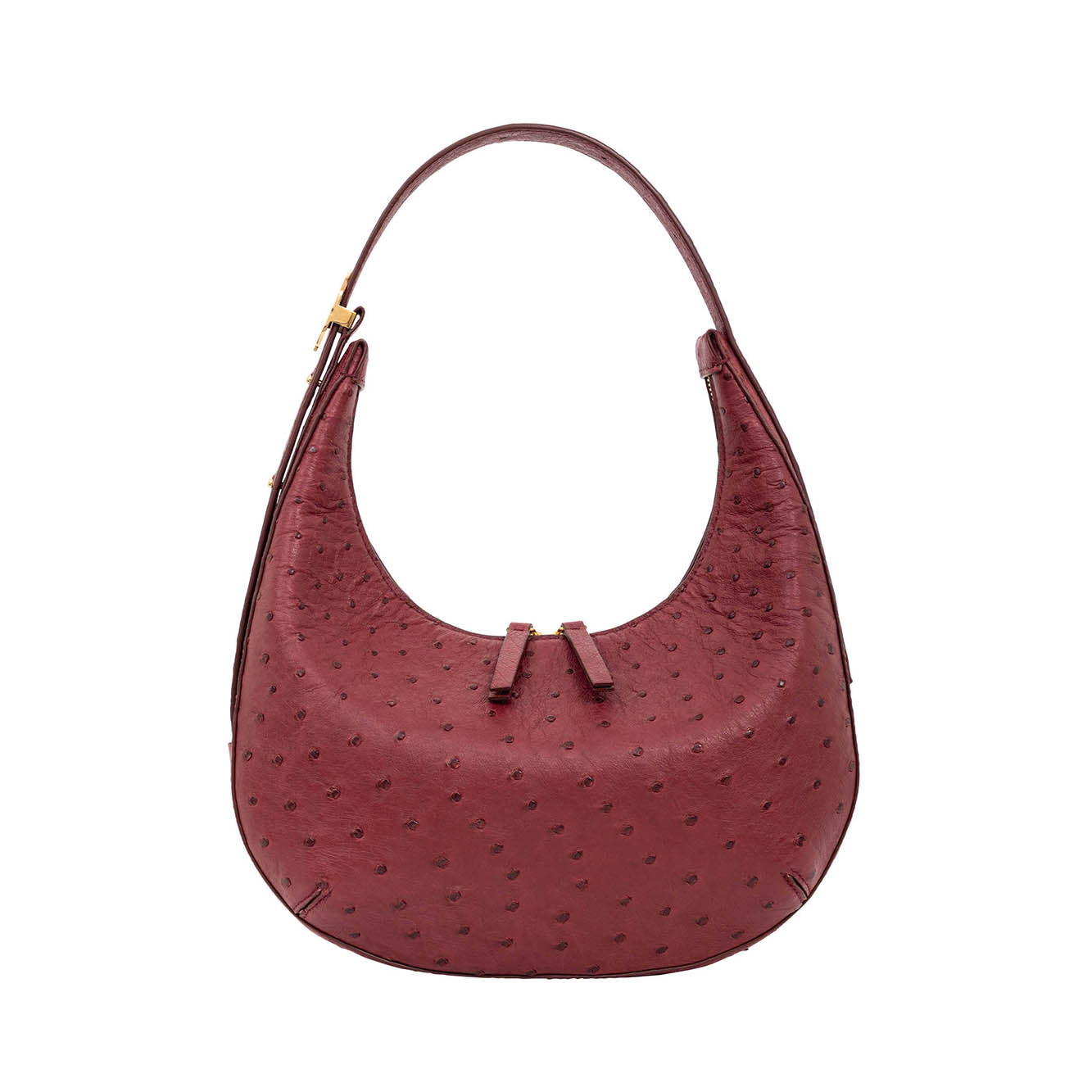 Red handbag with a textured surface on a white background