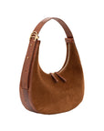 Brown suede handbag with gold accents on a white background