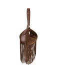Side of cognac suede handbag with fringe details on a white background